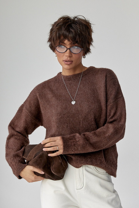 В'язаний теплий джемпер з візерунками косичок