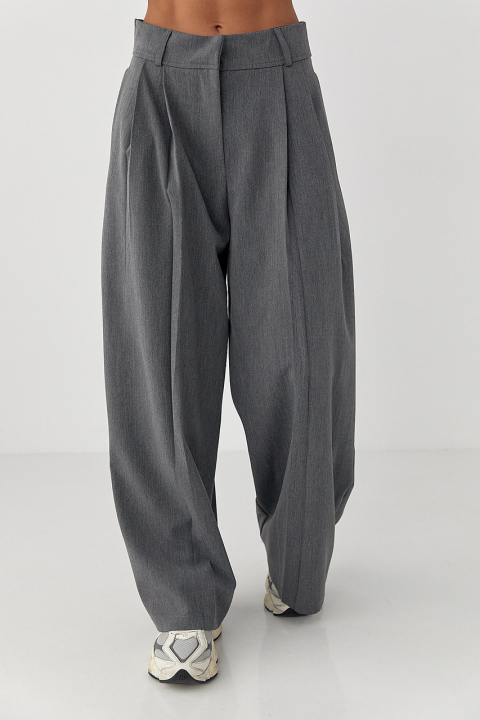 Класичні однотонні штани-палаццо зі складками