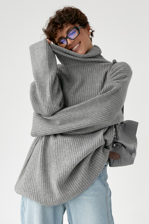 Теплая вязаная туника в рубчик